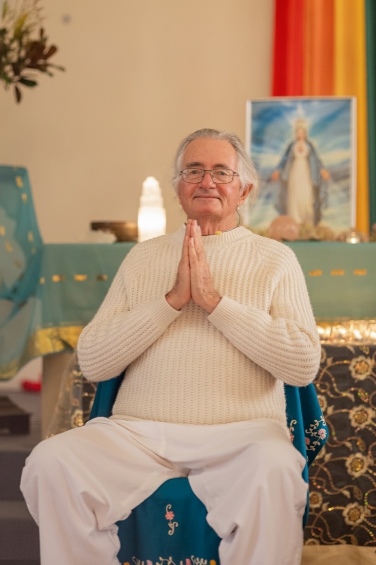 Mello Edwards in prayer at the Temple altar